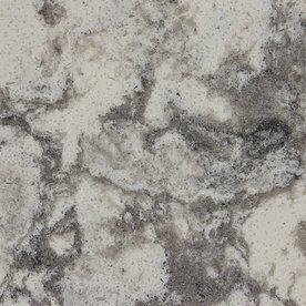 A close up of a white and gray marble counter top.