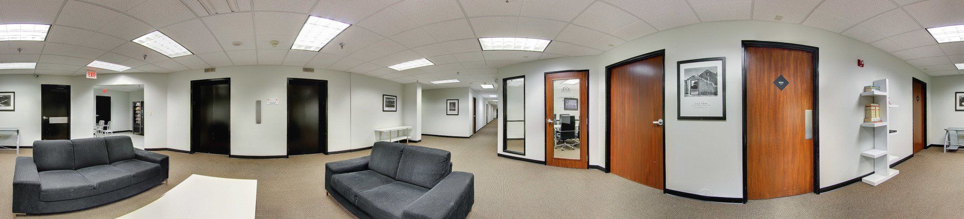 basement panorama with 2 couches and a table