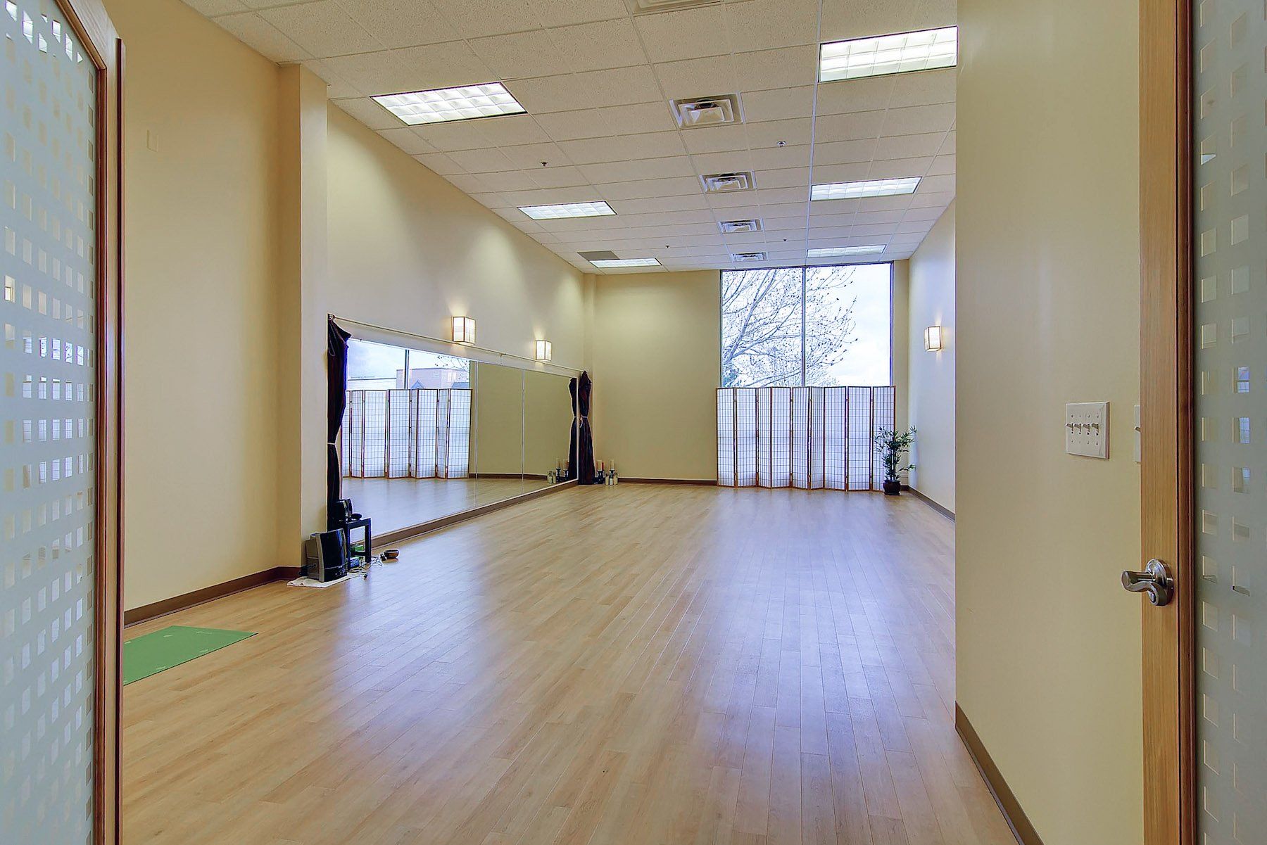 spacious yoga room with hard wood floors