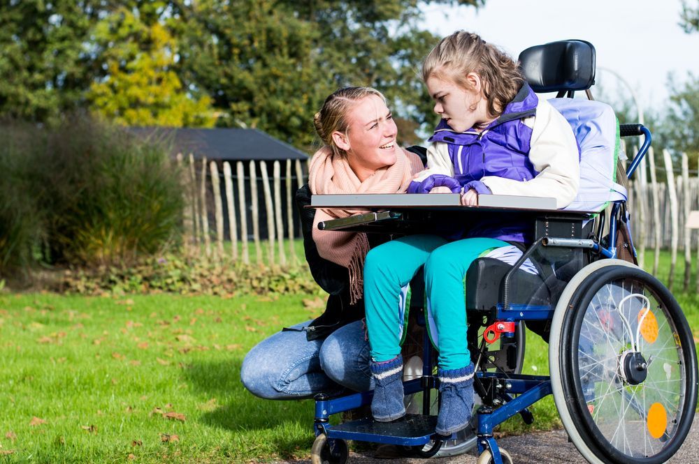 Woman and Girl in a Wheelchair Outside — Sonke Support Pty. Ltd. in Buderim, QLD