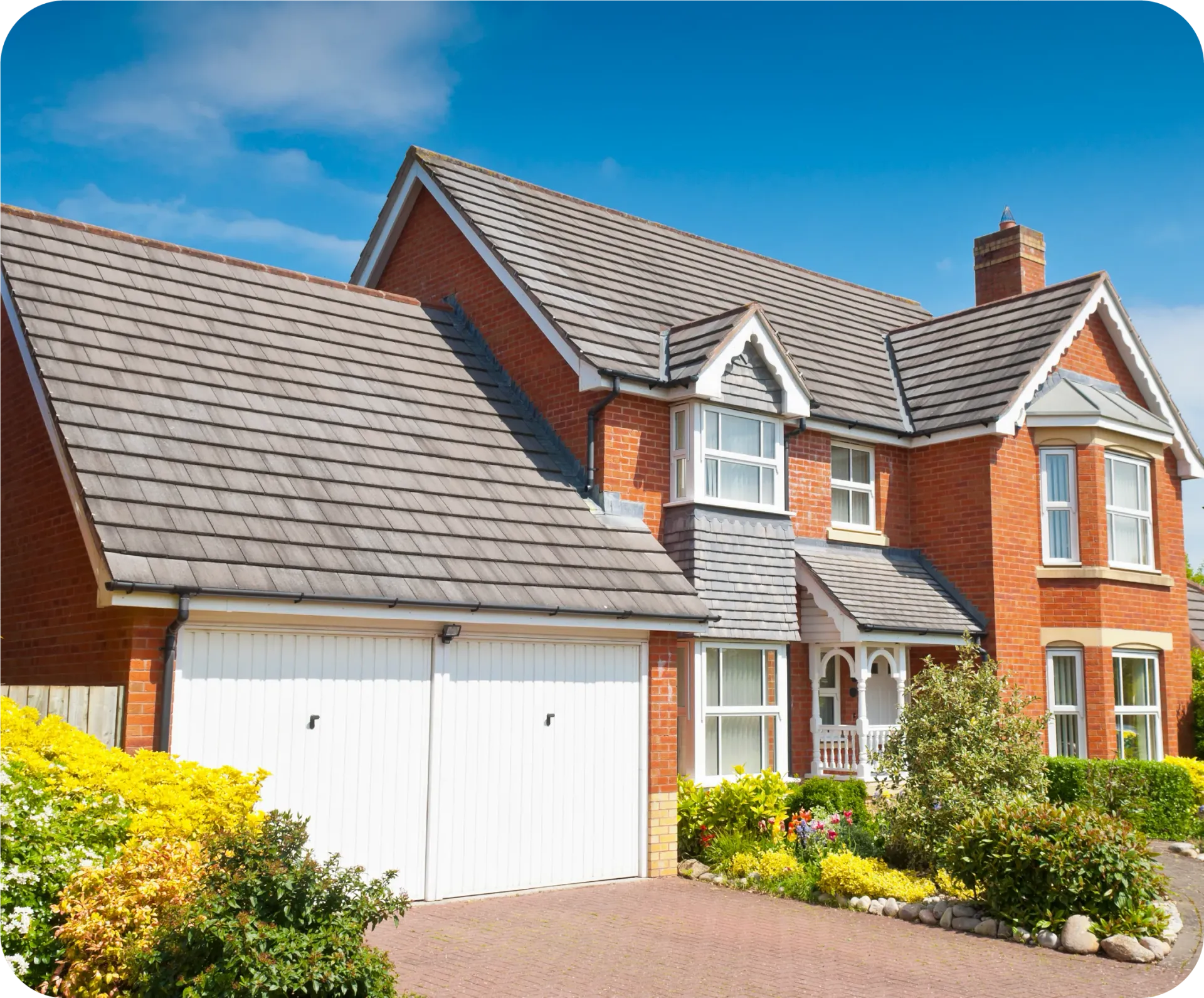 A man is working on the side of a building with a crane.