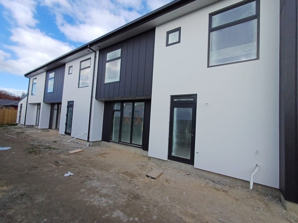 A white and black building with a lot of windows