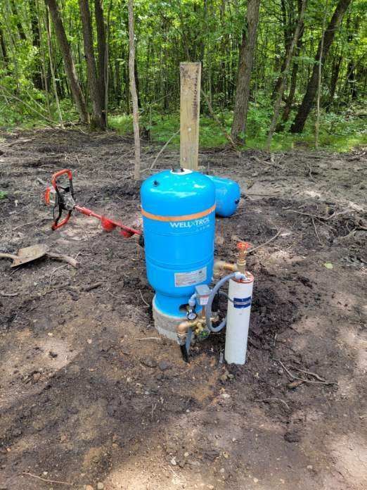 A man ready to give maintenance to the home well water system.