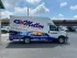 Mullen Heating & Air service van parked in a lot under a sunny sky