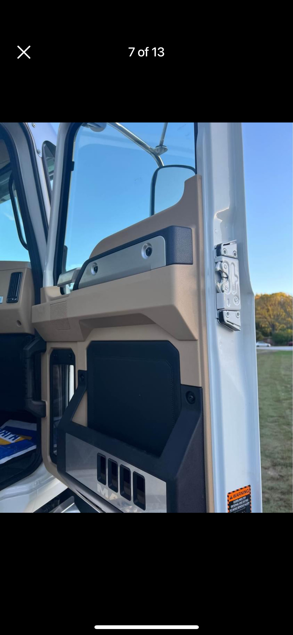 A picture of the inside of a truck with the door open.