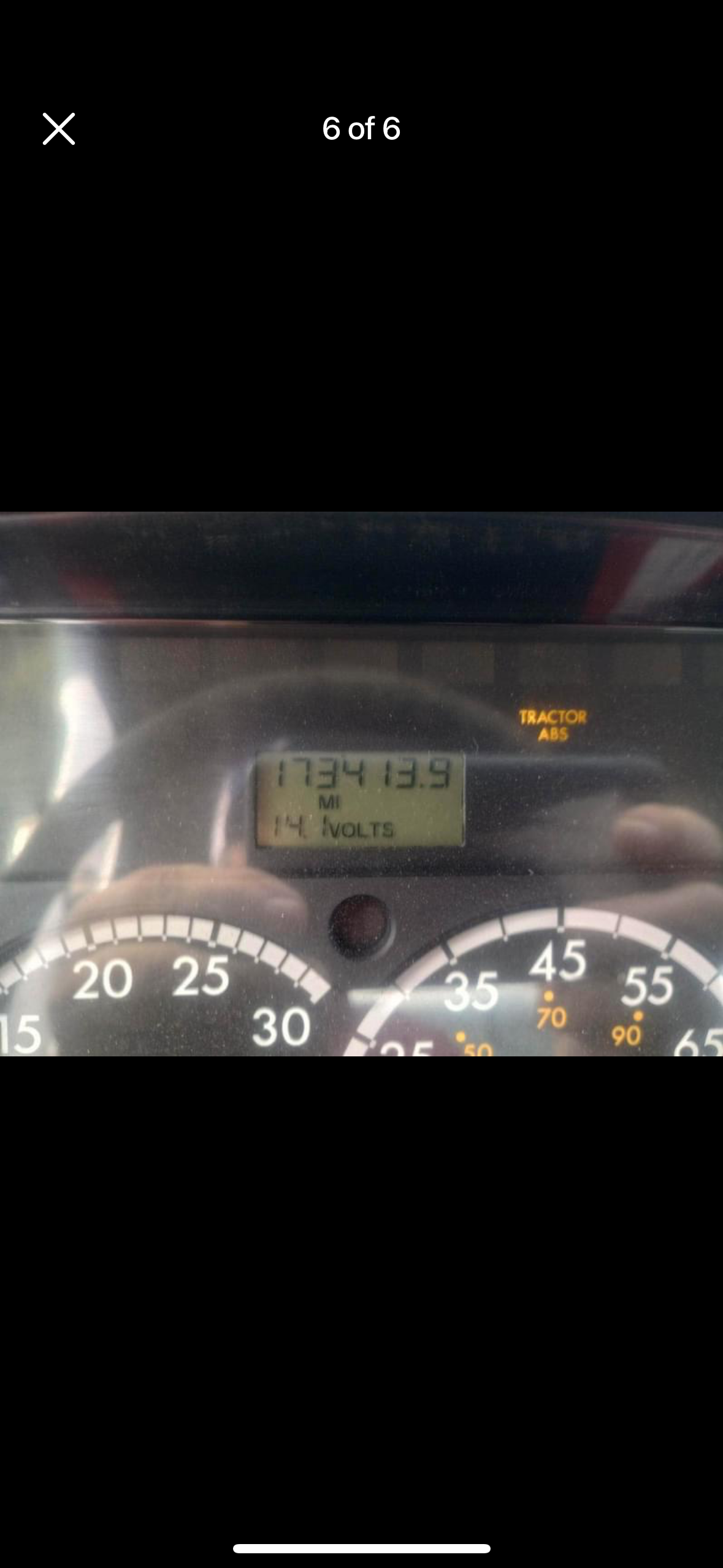 A person is driving a car and the speedometer shows that they are going very fast.
