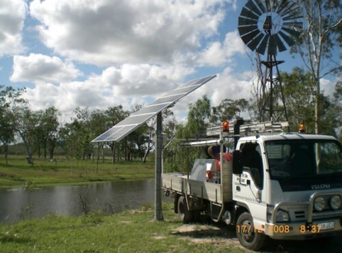 Company Truck Parked Next To Solar Panels — Water Filtration in Bundaberg, QLD