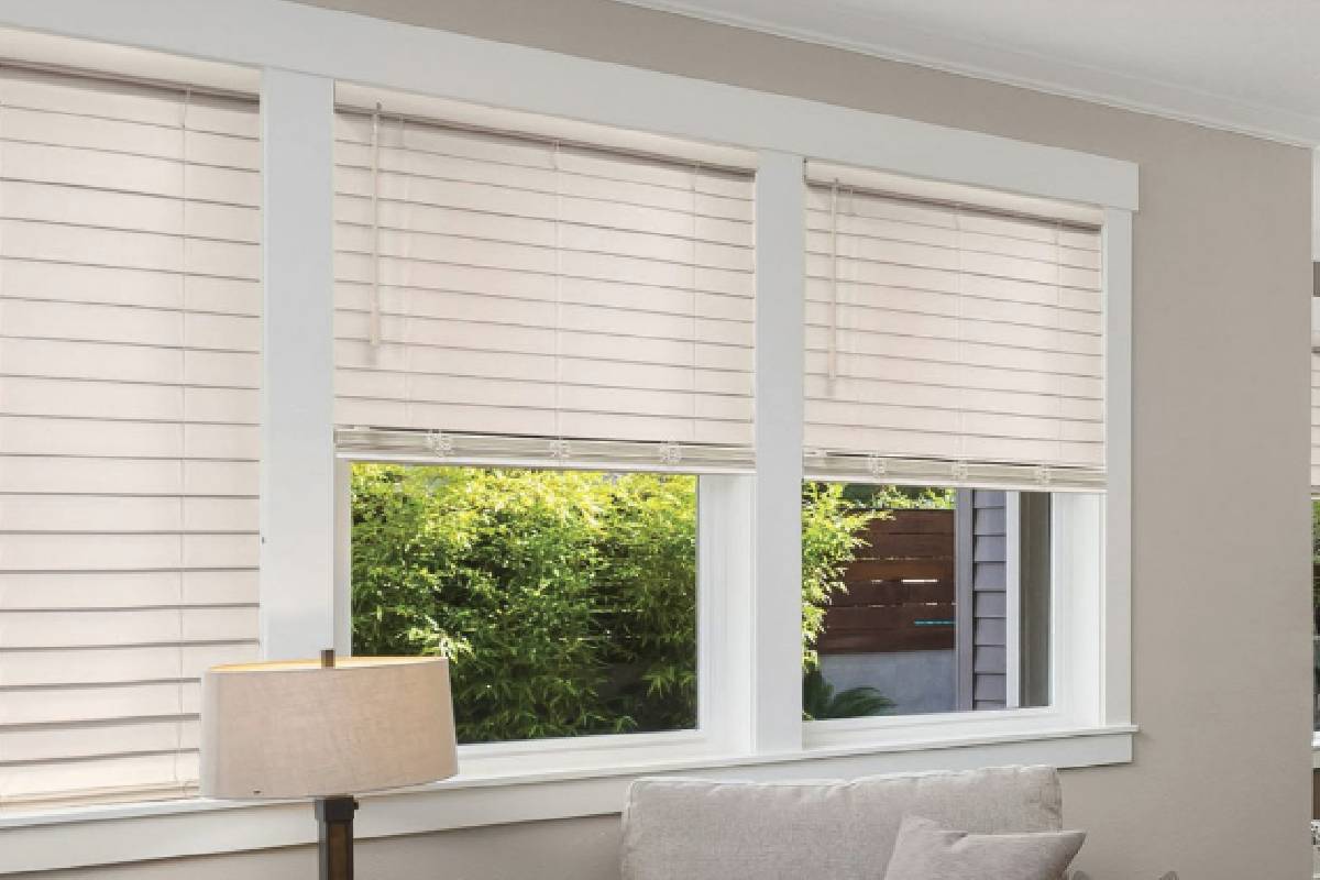 Norman SmartPrivacy® Faux Wood Blinds in a seating area