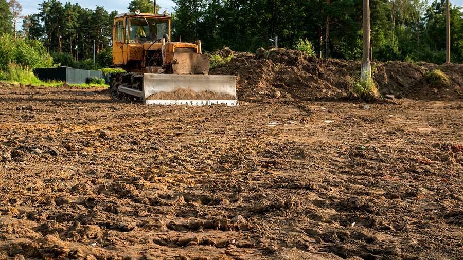 A man is cleaning a window with a squeegee.