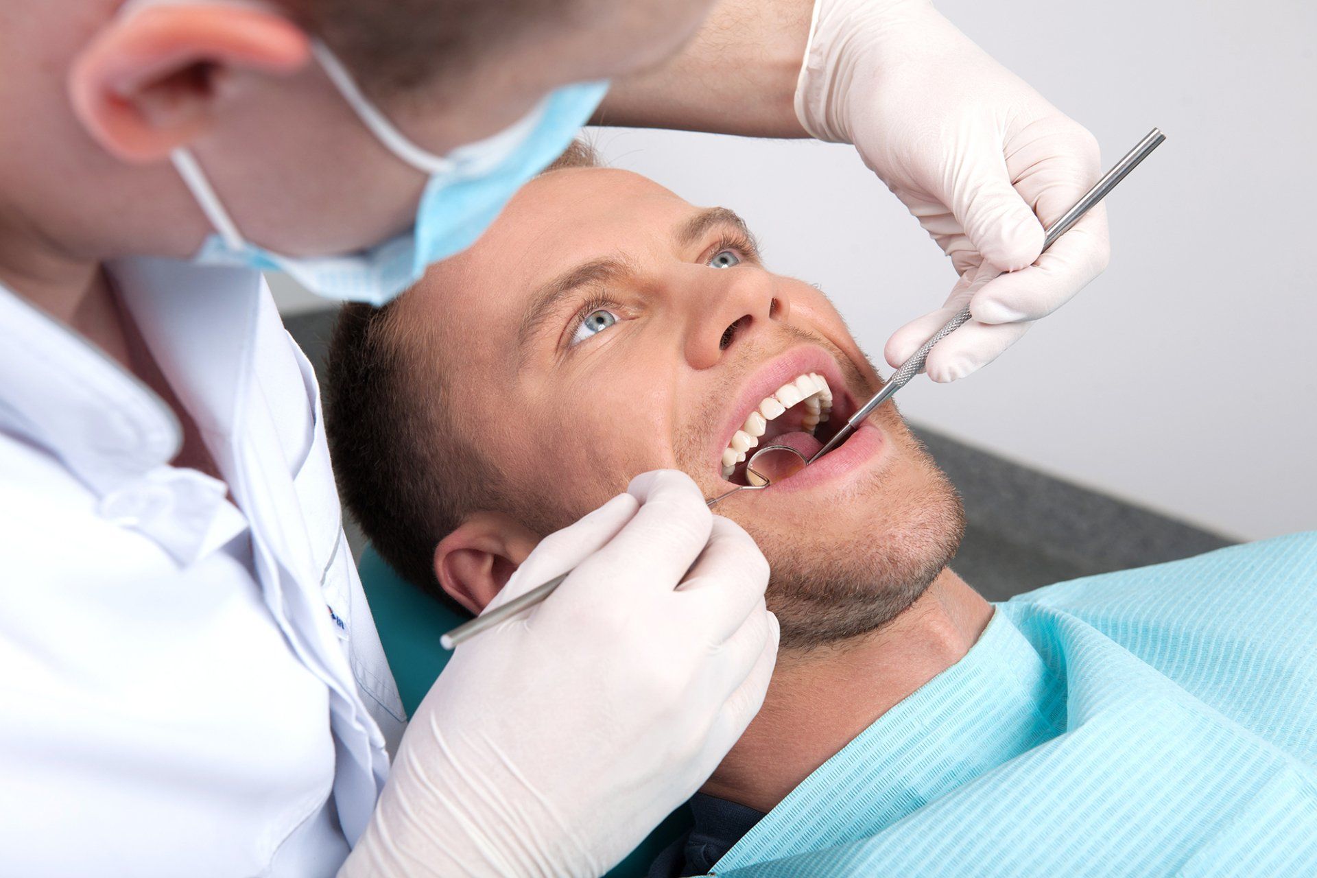 man+getting+dental+exam