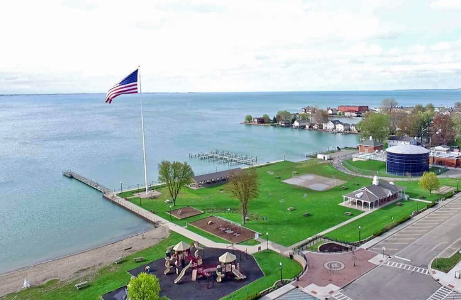 Tallest Flag, Shore of Anchor Bay and Walter and Mary Burke Park near On The Bay restaurant, bar, and boutique in downtown New Baltimore Michigan