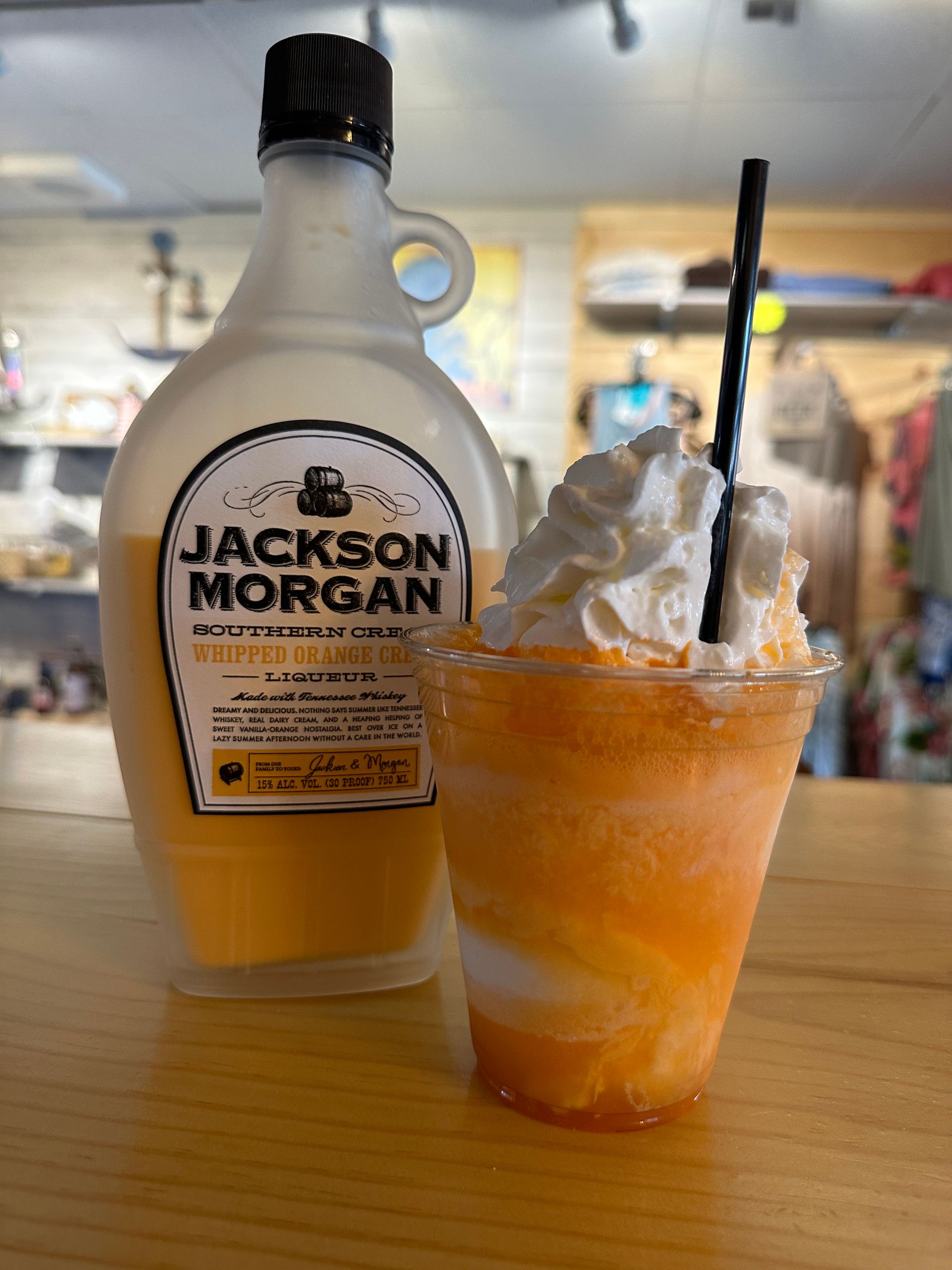 A cup of jackson morgan next to a bottle