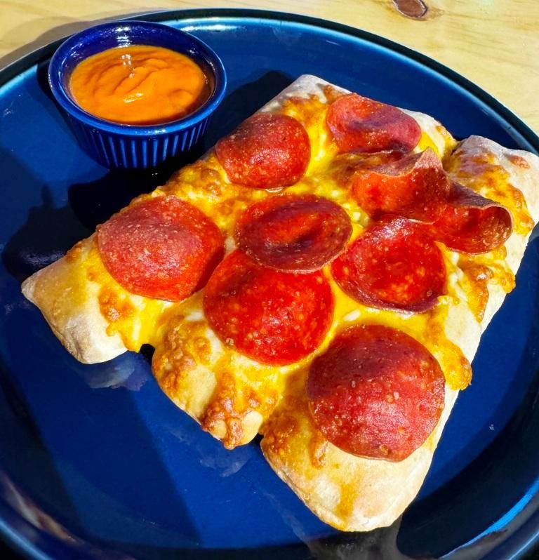 On The Bay Late Night Bite appetizer of Cheese and pepperoni Bosco sticks, pizza with dipping sauce