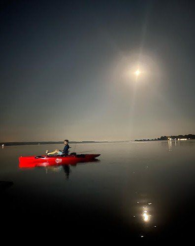 Kayaking under the moon.