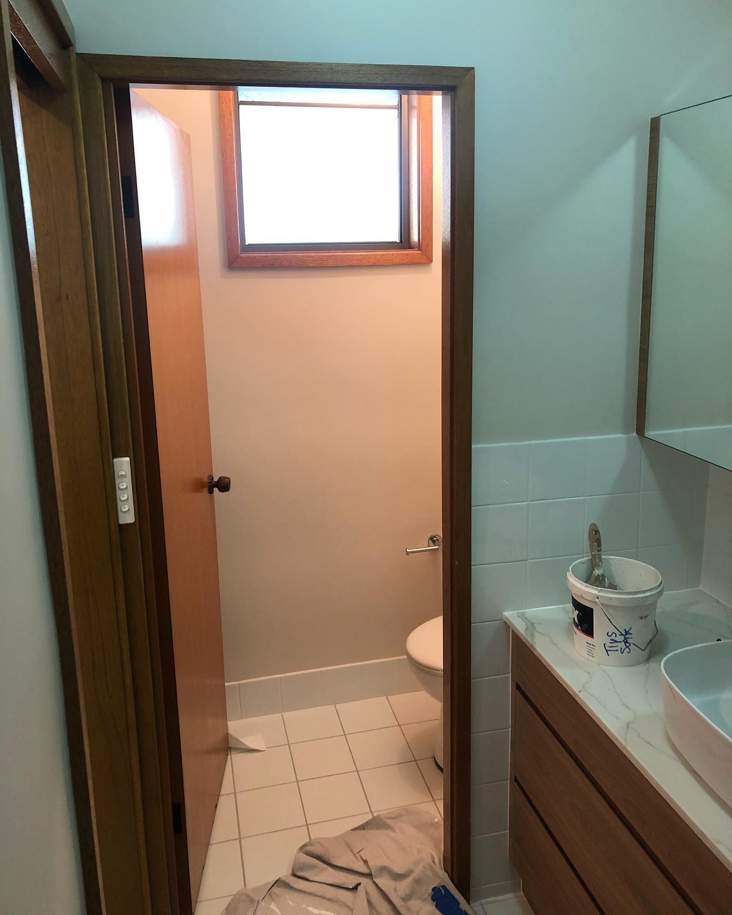 A Bathroom With a Sink and Toilet and a Window — The Big Bearded Painter In Bulahdelah, NSW