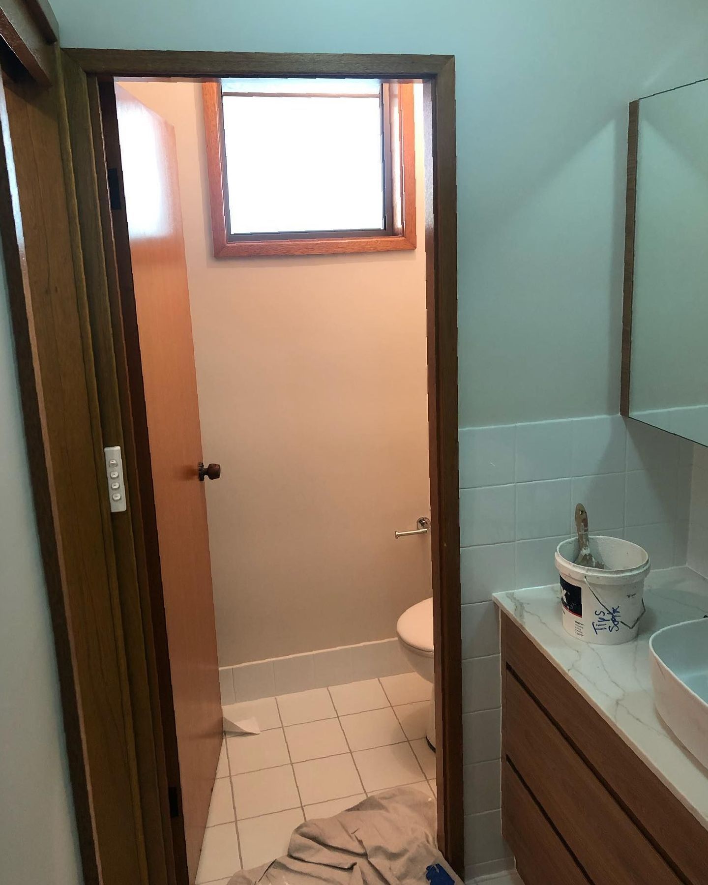 A Bathroom With a Sink and Toilet and a Window — The Big Bearded Painter In Hunter Valley, NSW