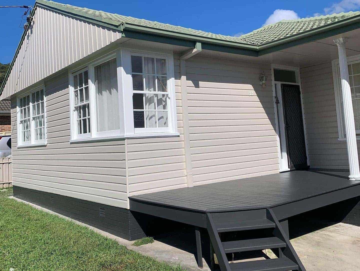 A White House With a Black Deck and Stairs in Front of It — The Big Bearded Painter In Kurri Kurri, NSW