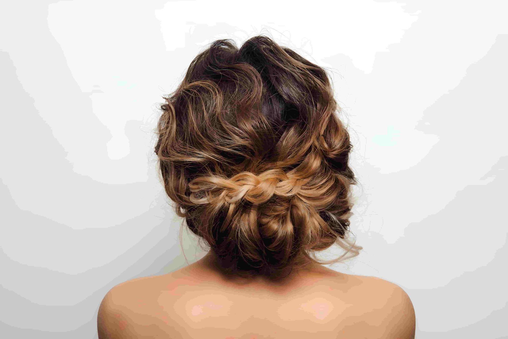 The Back Of A Woman With Her Hair In A Bun — Kabello Salon In Airlie Beach, QLD