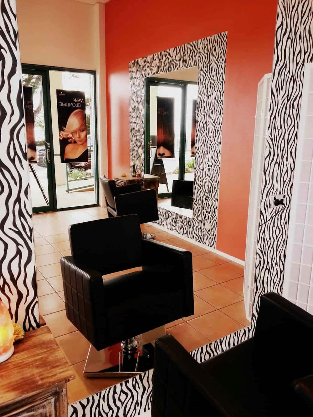 A Hair Salon With A Chair And A Mirror — Kabello Salon In Airlie Beach, QLD
