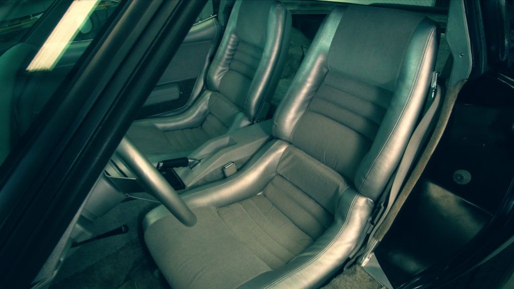 Gray leather car seats inside a vehicle.
