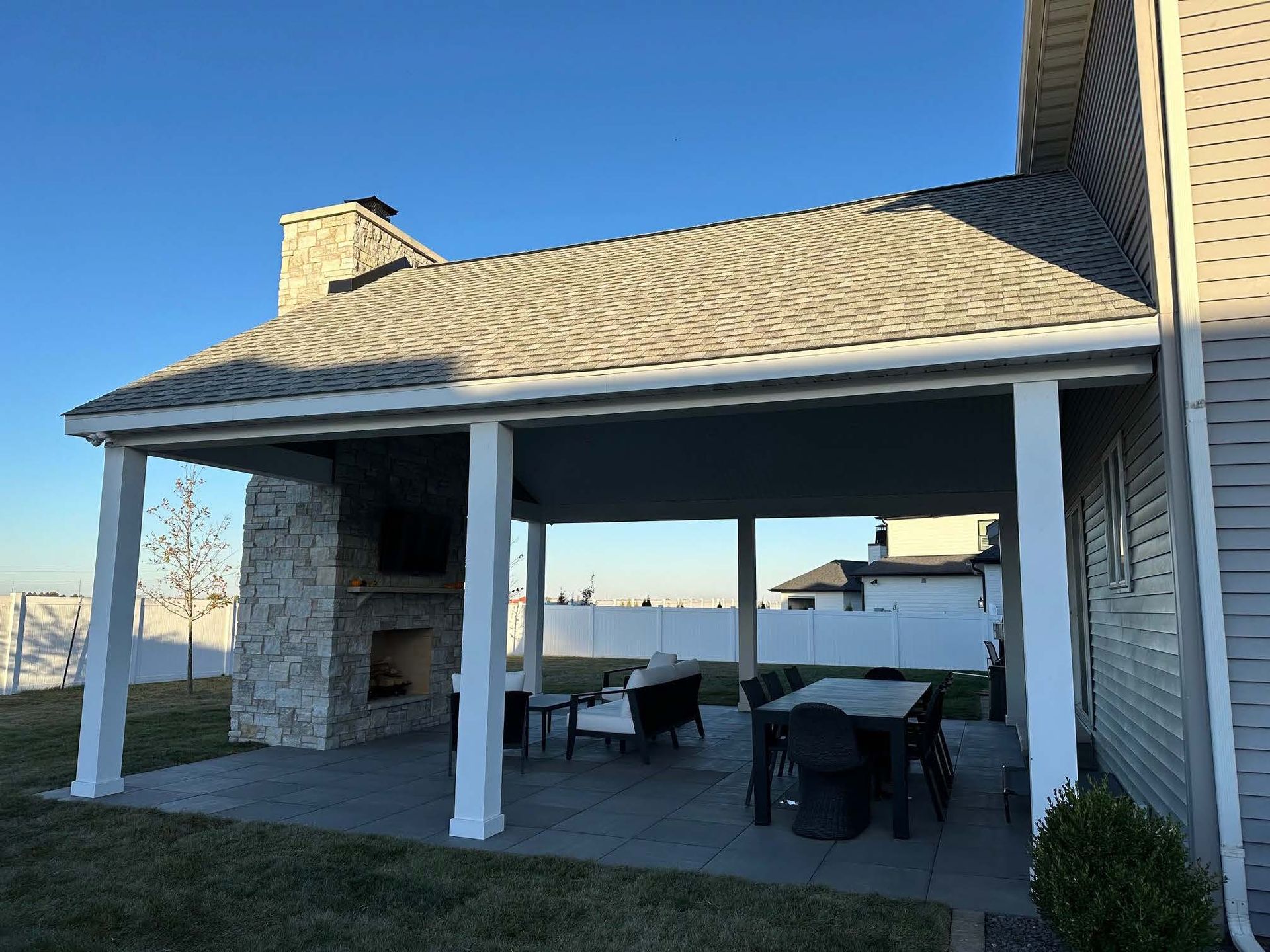 An empty basement with a wooden ceiling and walls.