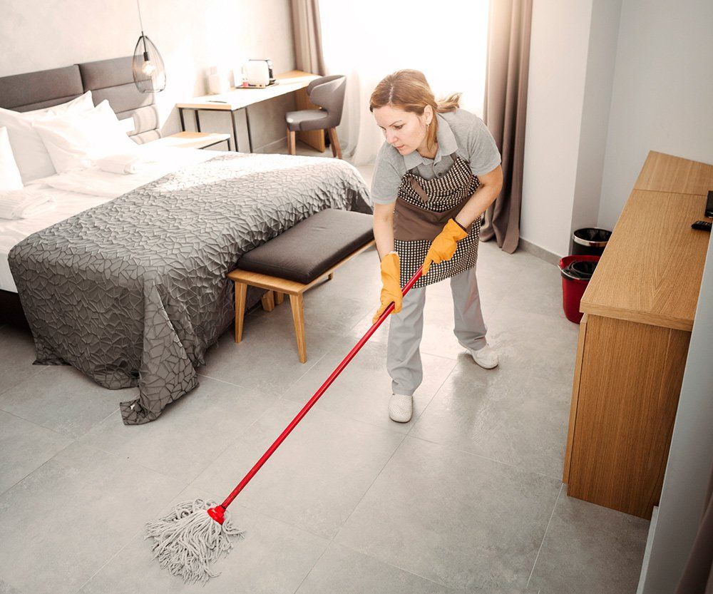 Worker Cleaning The Floor — Laguna Niguel, CA — Margaret’s Cleaning Service