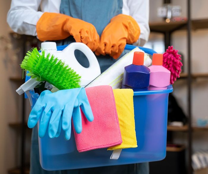 Person Holding Cleaning Products — Laguna Niguel, CA — Margaret’s Cleaning Service