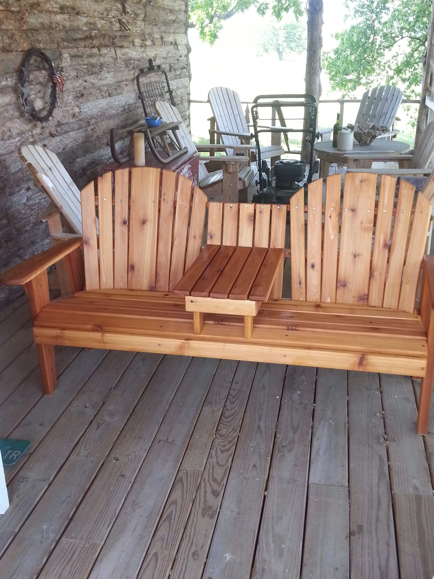 A wooden bench with a small table underneath it
