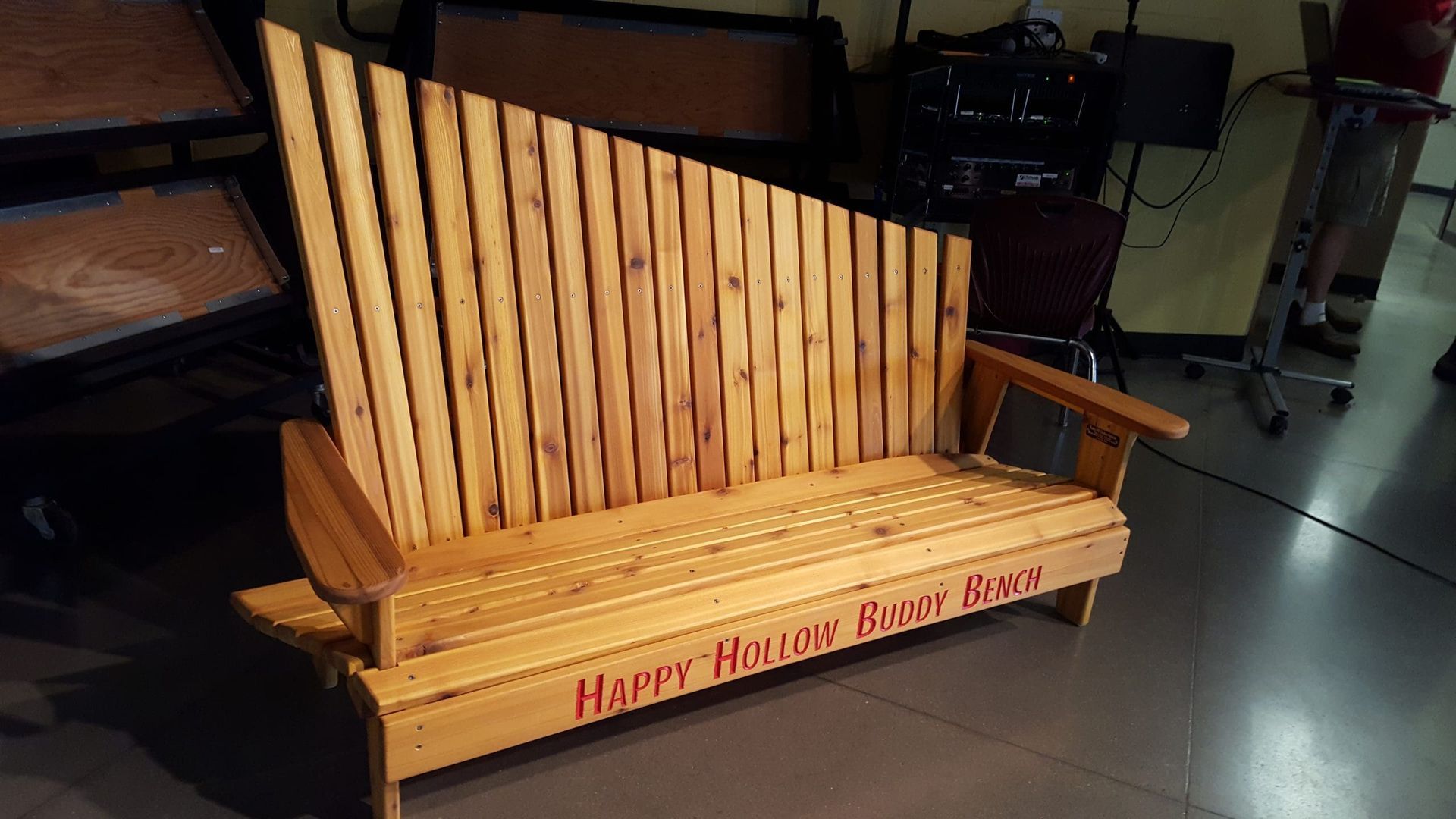 A wooden bench with the words harper 's beach blues on it