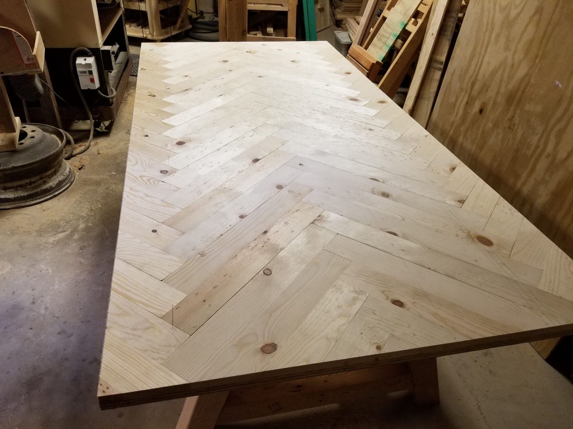 A wooden table with a herringbone pattern on it