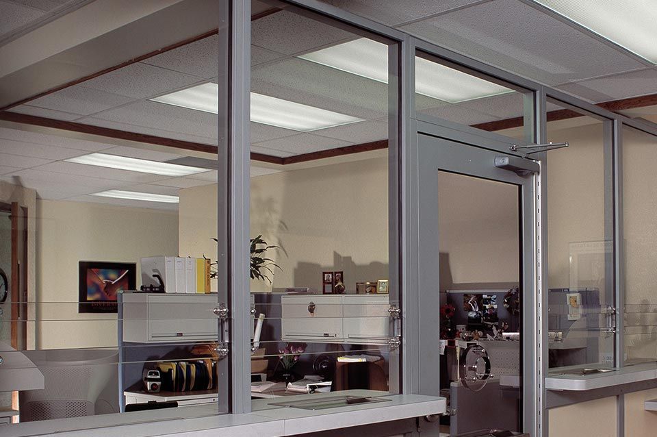 An office with a glass door and a counter