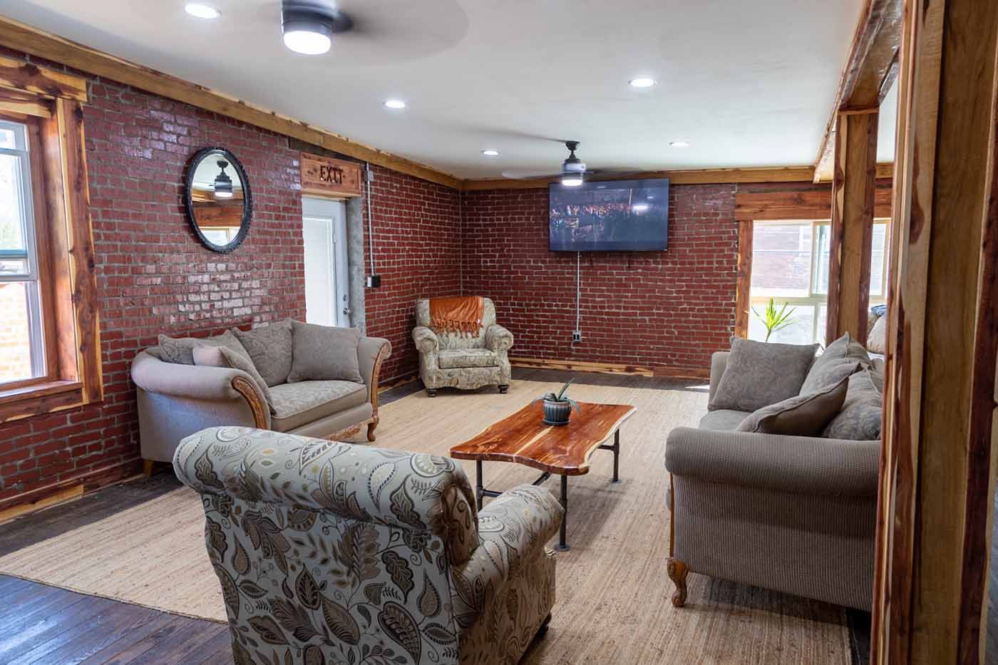 A living room filled with furniture and a flat screen tv.