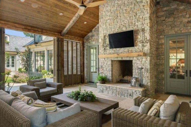 A living room with a fireplace and a flat screen tv.