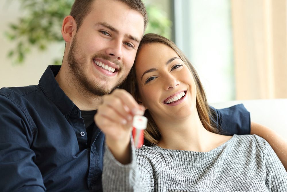 Couple Holding Keys of New House