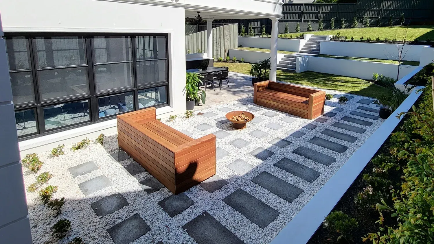 Outdoor Patio With Stone Pathway and Modern Wooden Furniture — Total Perfection In Killara, NSW