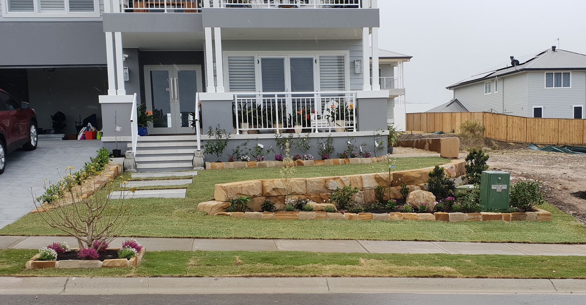 Modern Two-storey House With Stone Landscaping — Total Perfection In Kariong, NSW