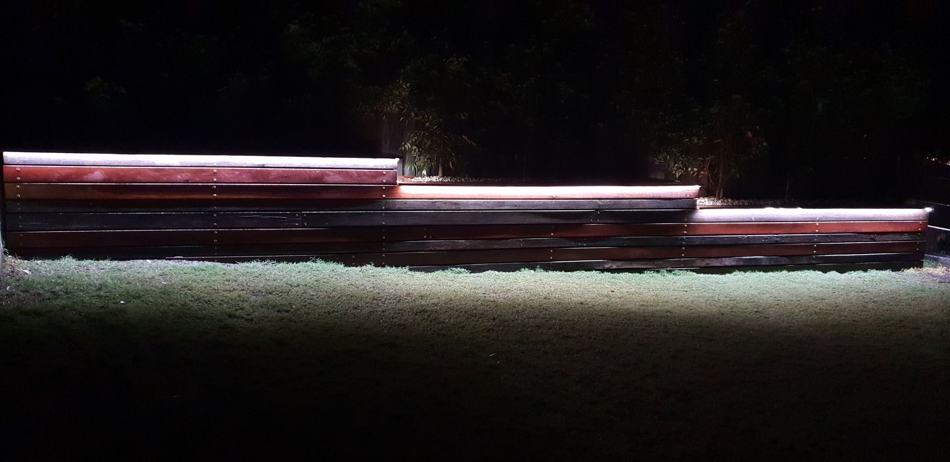 Three Illuminated Platforms in a Dark Setting — Total Perfection In Kariong, NSW