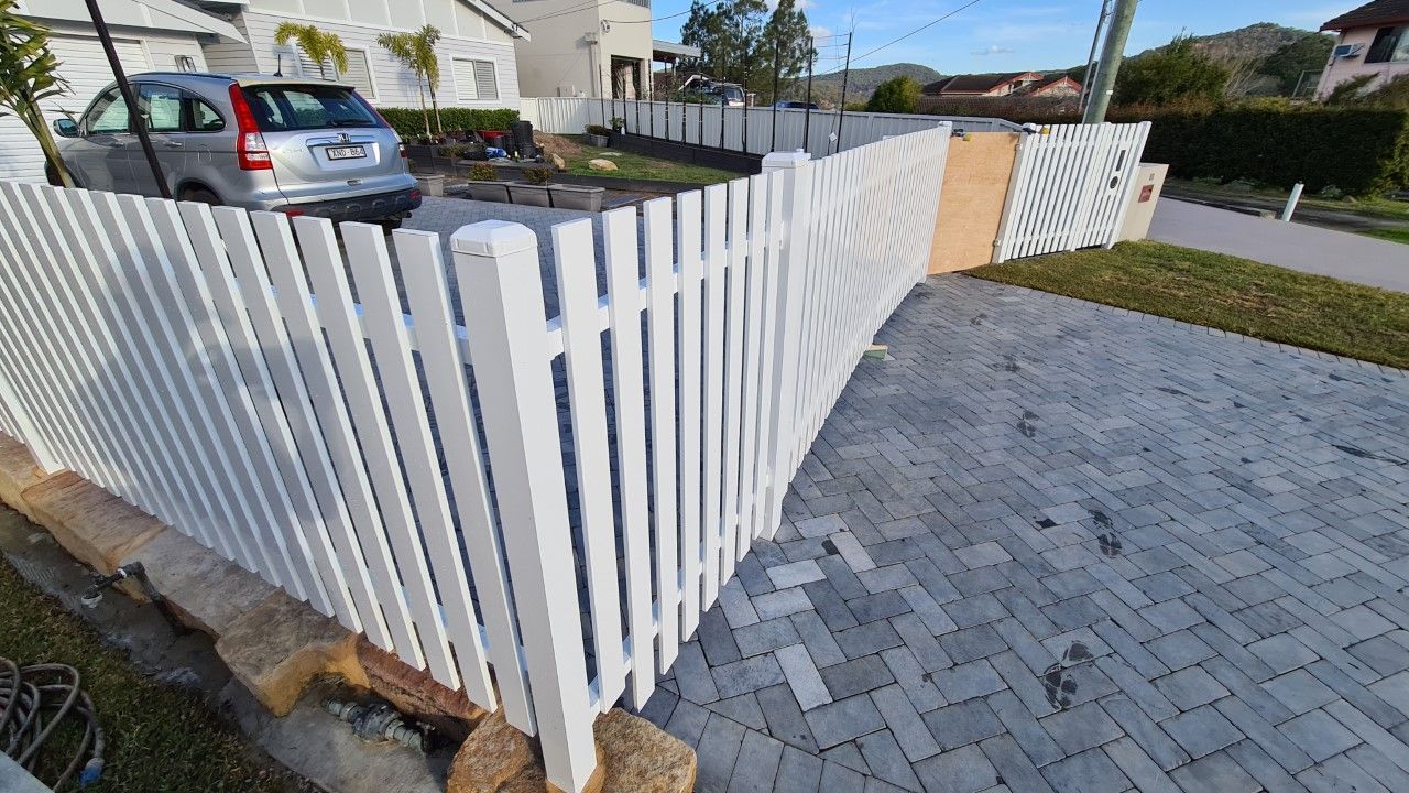 White Picket Fence Along a Brick Driveway — Total Perfection In Terrigal, NSW