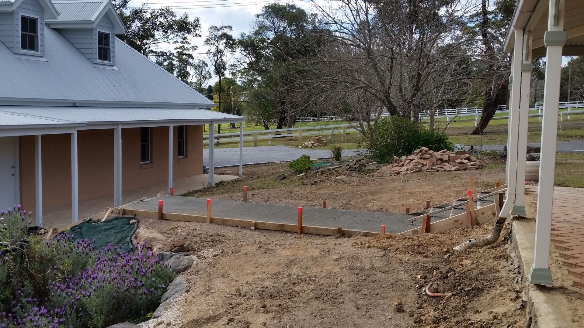 Pathway Construction in Progress Near a House — Total Perfection In Bateau Bay, NSW