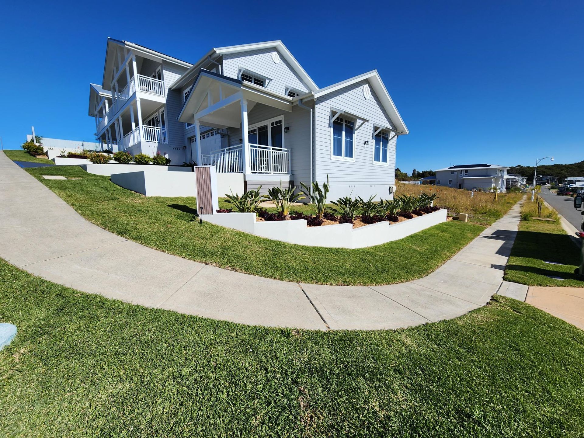White Multi-storey Building on a Grassy Hill — Total Perfection In Terrigal, NSW