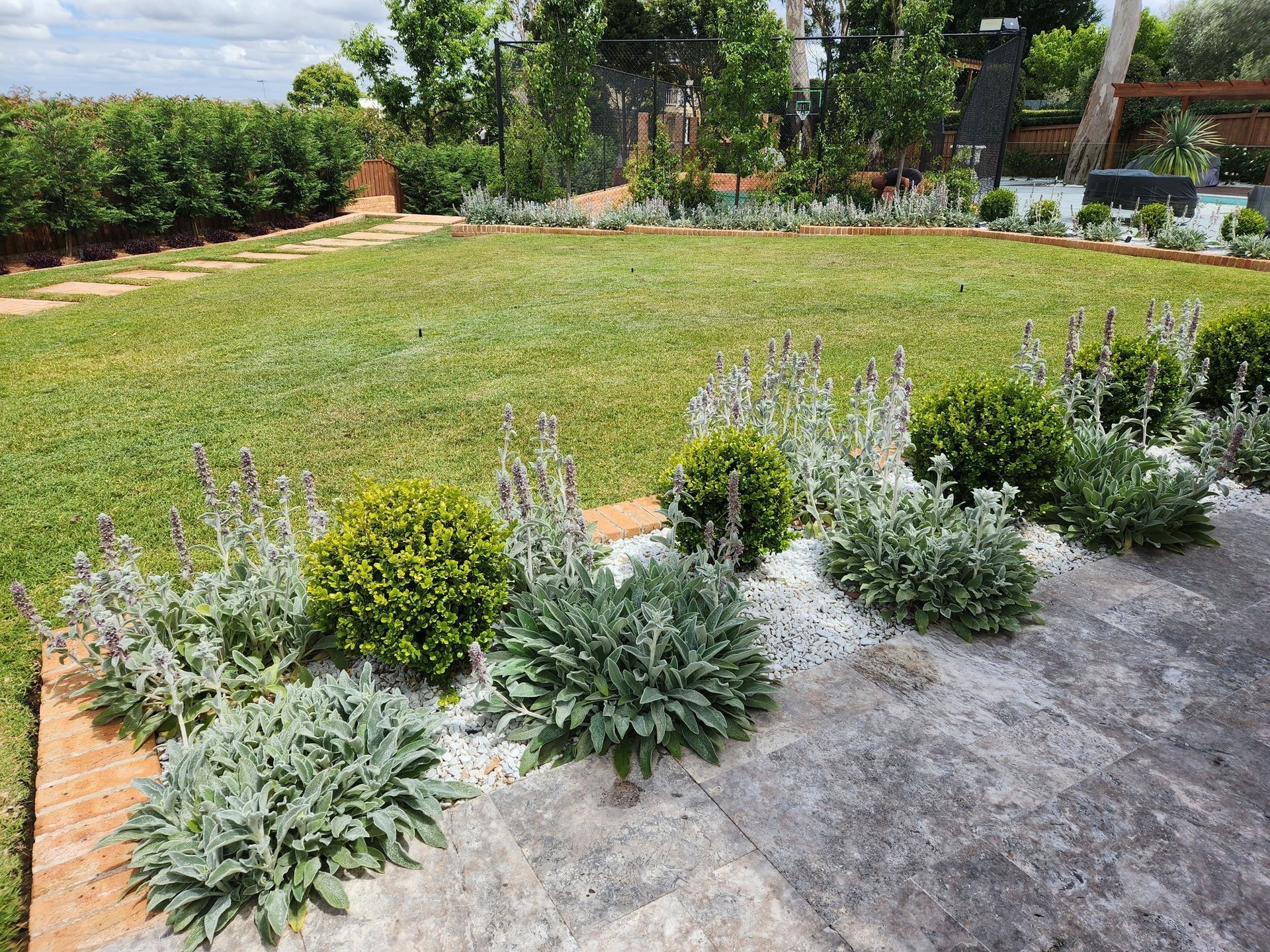 Lush Garden with Various Plants, Lawn, and Stone Patio — Total Perfection In Kariong, NSW