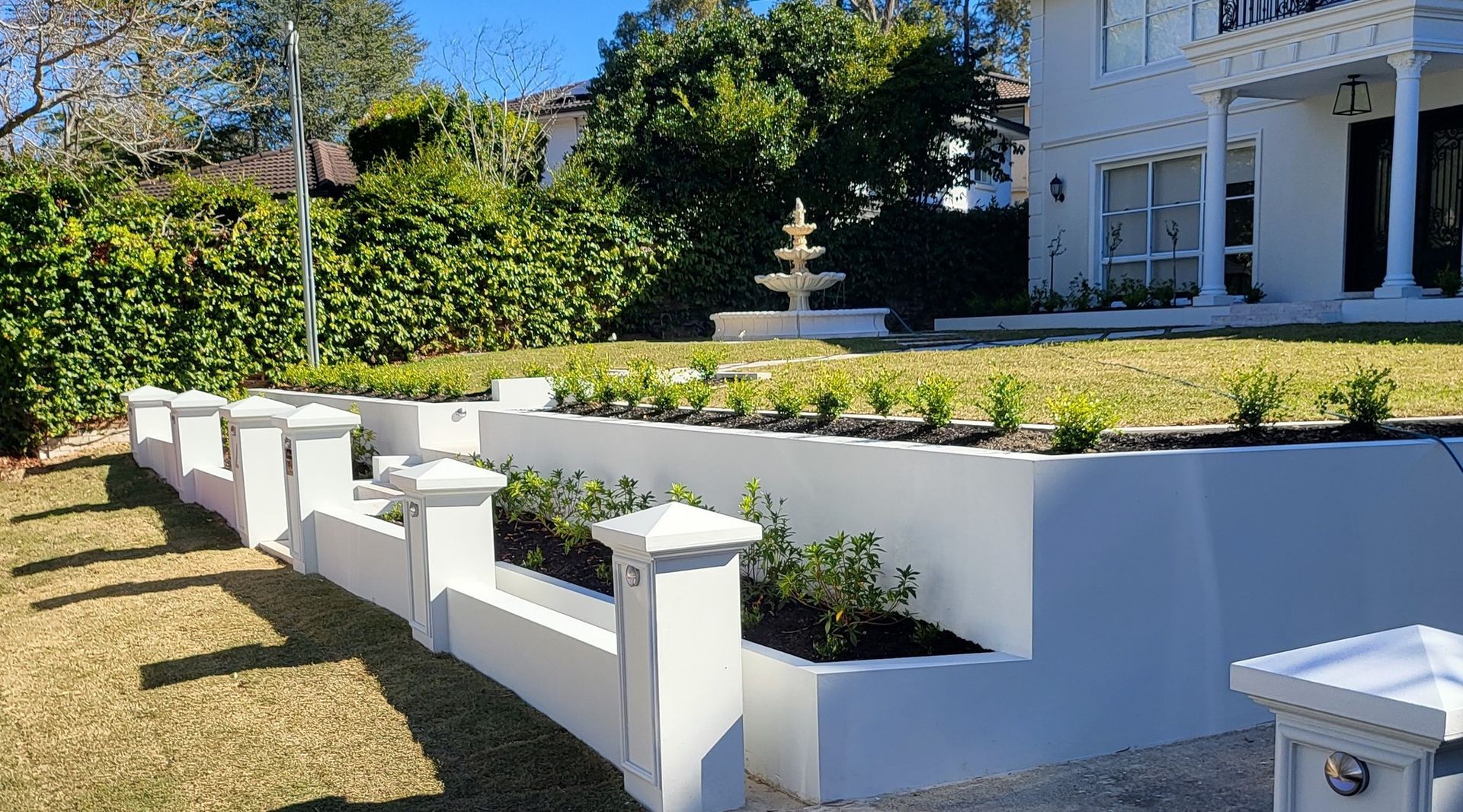 White Retaining Wall With Pillars — Total Perfection In Bateau Bay, NSW