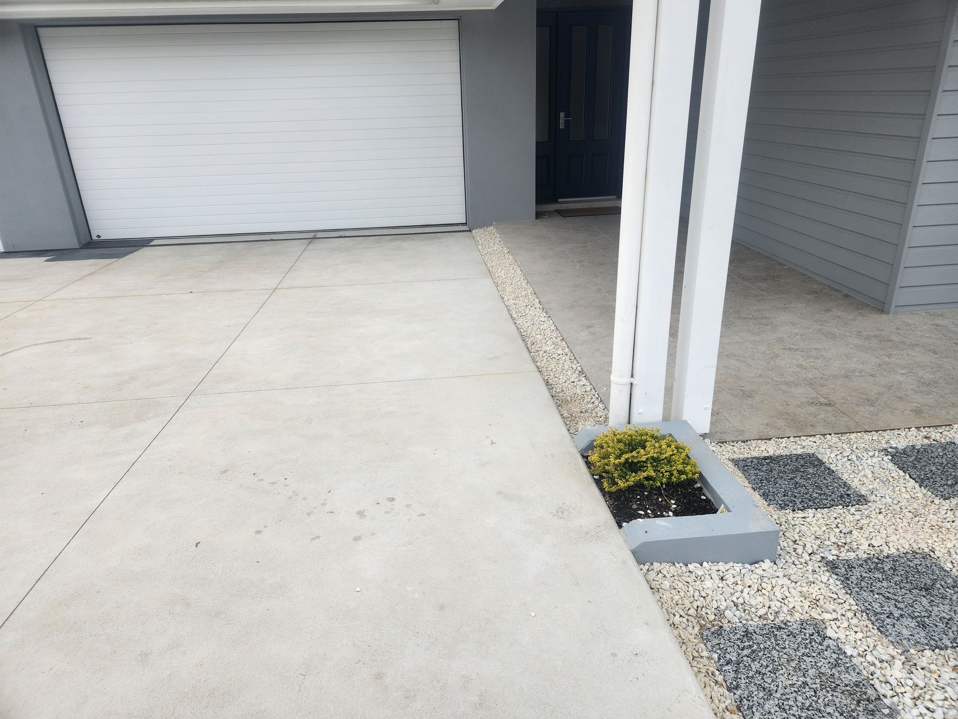Concrete Driveway With Garage Door — Total Perfection In Kariong, NSW