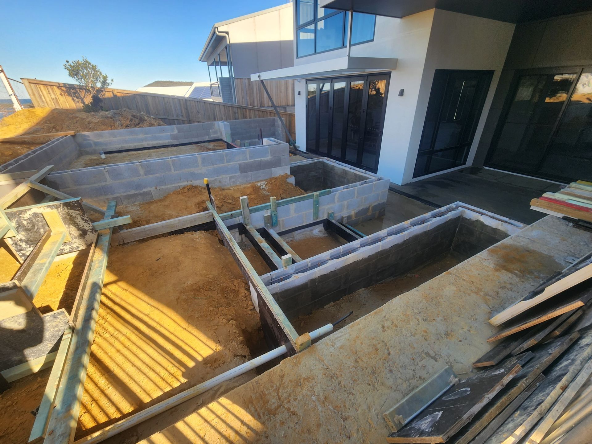 Construction Site With Raised Garden Beds and Building — Total Perfection In Terrigal, NSW