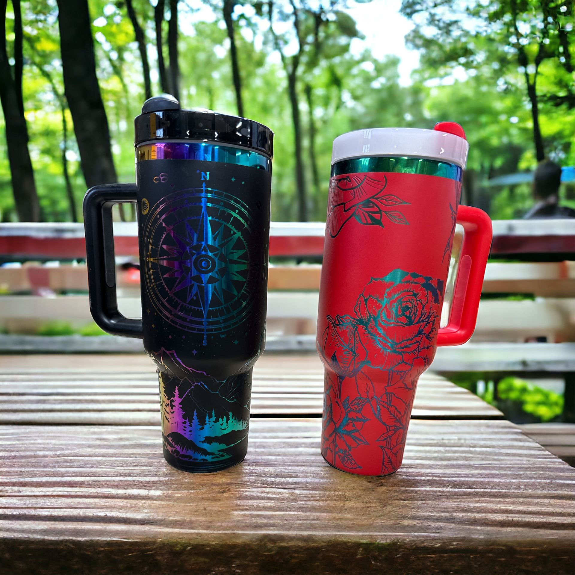 two stanley cups are sitting on a wooden table