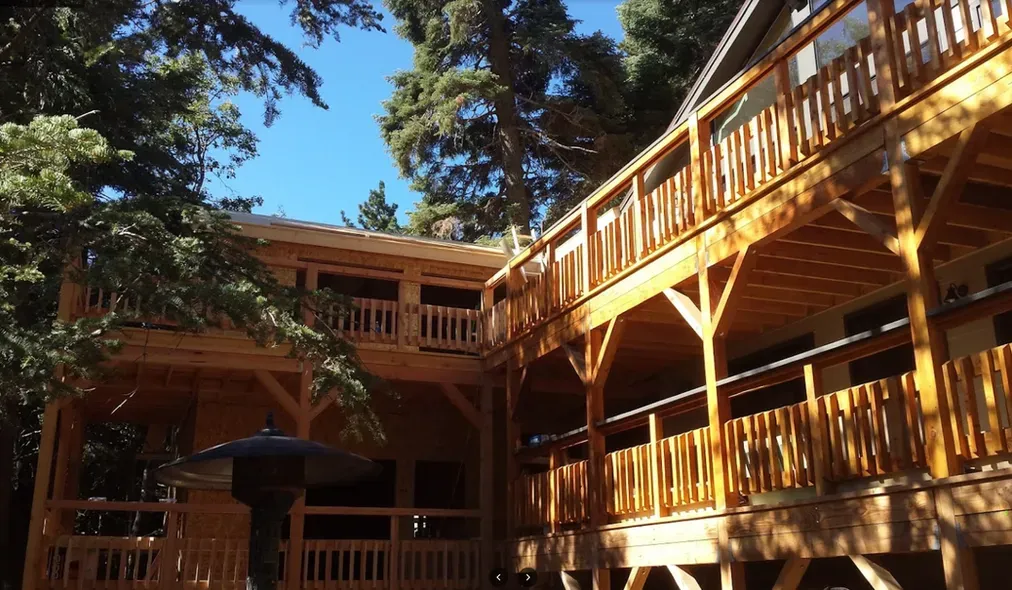 A large wooden house with a lot of balconies