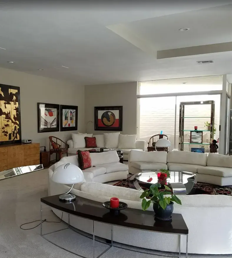 A living room filled with furniture and a lamp