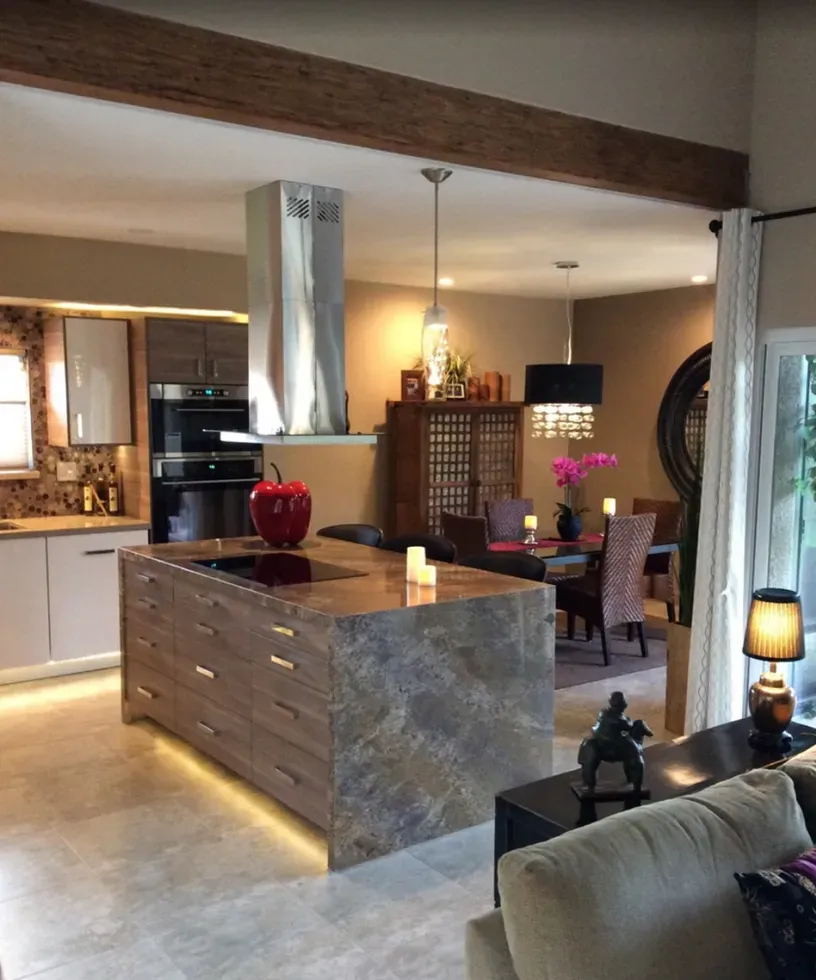 A kitchen with a large island in the middle of it