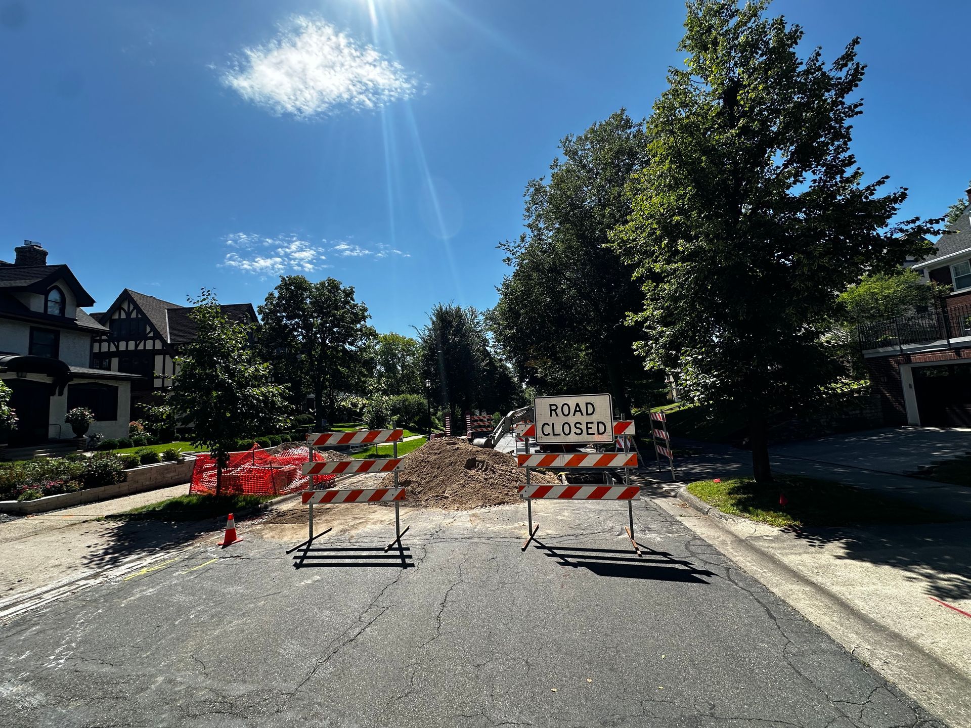 Road blocked by barriers and a 