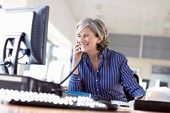 Mature Woman Using Telephone - Commercial Generators in Layton, UT